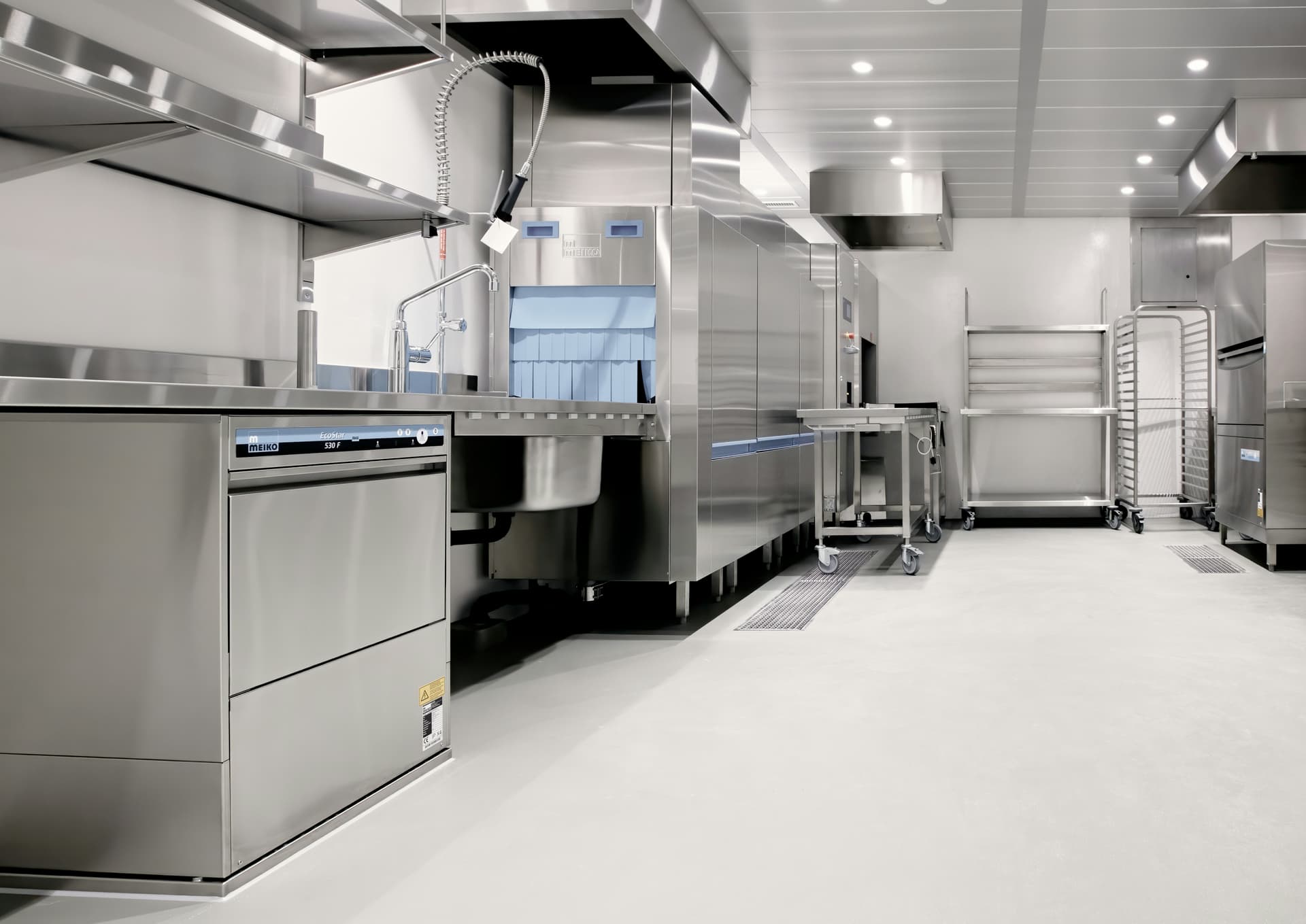 Professional kitchen with seamless grey epoxy floor coating